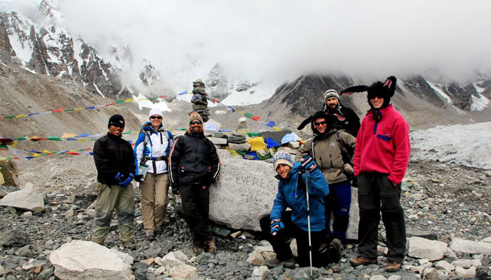 People take pictures to souvenir the day they get to Mt. Everest