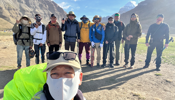 Travelers with a local Tibetan guide at Mount Kailash