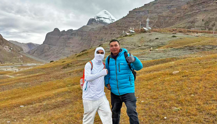 Travelers with a local Tibetan guide on the Mount Kailash Kora
