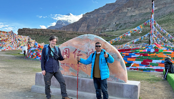 Travelers with a Tibetan guide on the Mount Kailash Kora