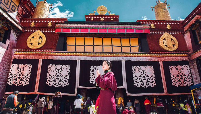 Local Tibetan pilgrims praying in front of Jokhang Temple