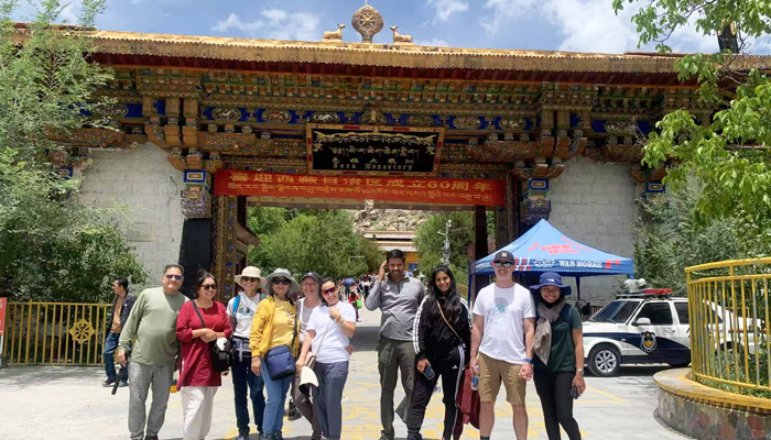 Our guests take photo at the entrance of Sera Monastery