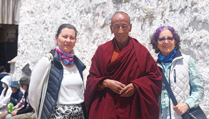 Take a photo with local Tibetan Monk