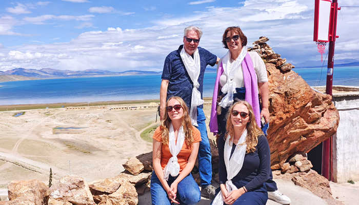 Family of four visiting Lake Manasarovar during a private Tibet tour