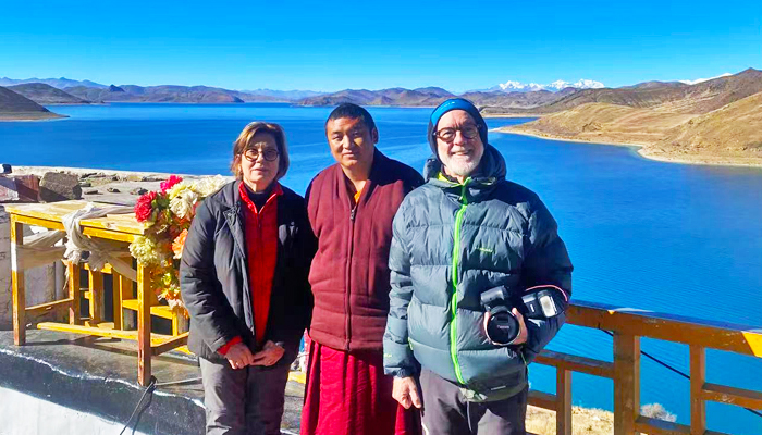 Take a photo with one resident monk at Rutok Monastery