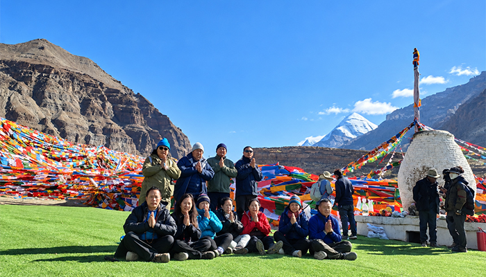 Travelers Praying near Tarboche Flagpole