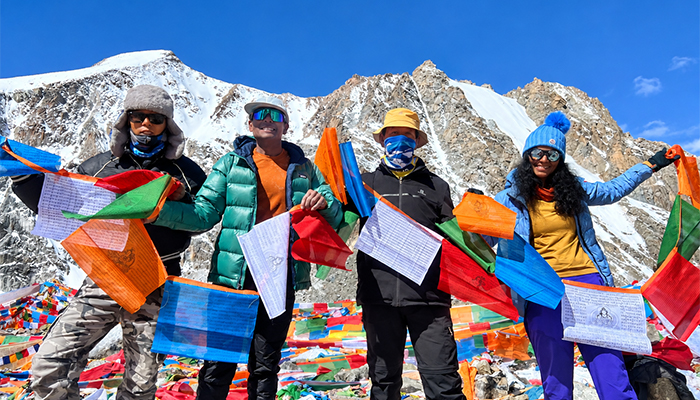 Travelers with Tibetan Prayer Flags