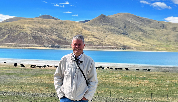 Guest walking along Yamdrok Lake