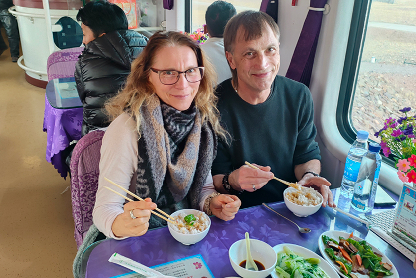 Meal service in dining car on Beijing Tibet train tour