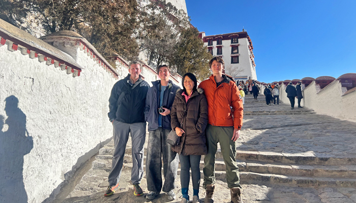 Climbing Potala Palace with proper footwear