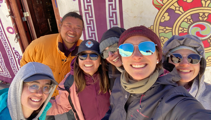 Guests explore Tibetan buildings with local guide
