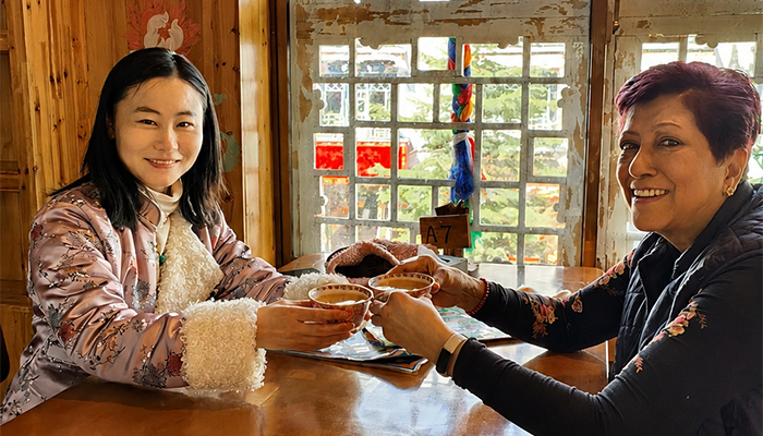Accept butter tea with both hands