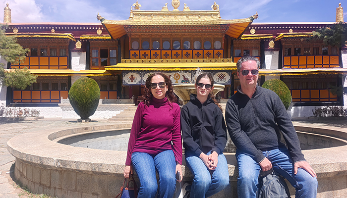 Family visiting Norbulingka Palace in Lhasa during spring