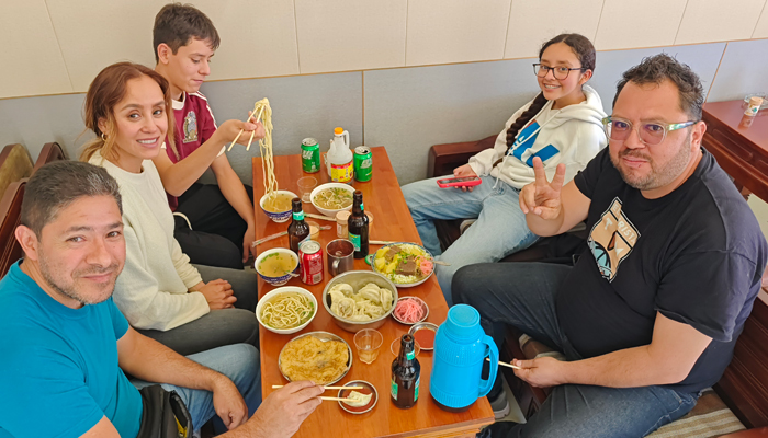 Children trying Tibetan food during a family trip in Lhasa