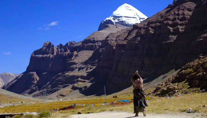Local Tibetan perform the kora trek around the Mount Kailash