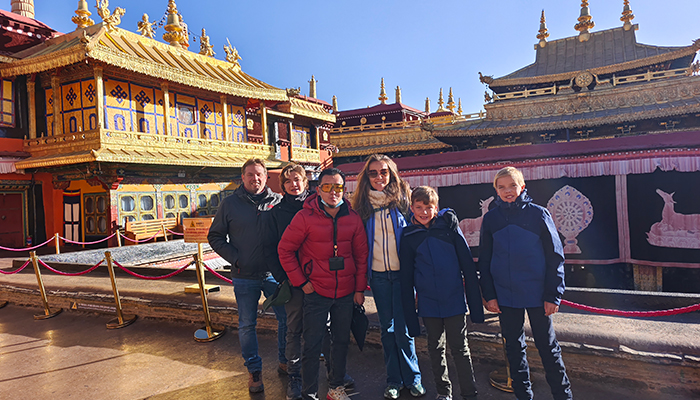 Family travelers visiting Jokhang Temple during a Tibet tour